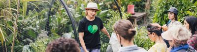 Person explaining about the garden to a group of people