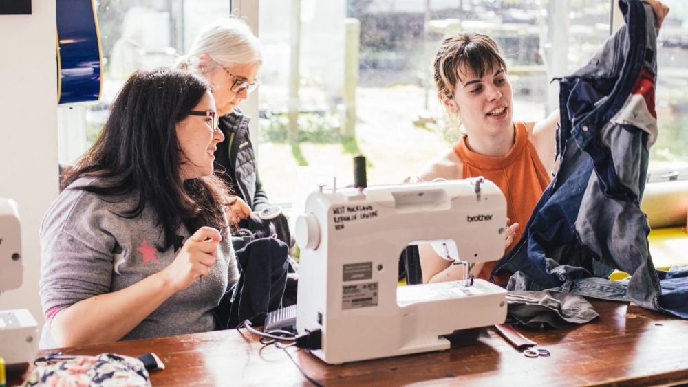 Attendees at a mindful mending workshop